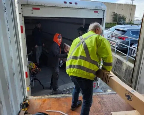 Our team safely loading heavy equipment